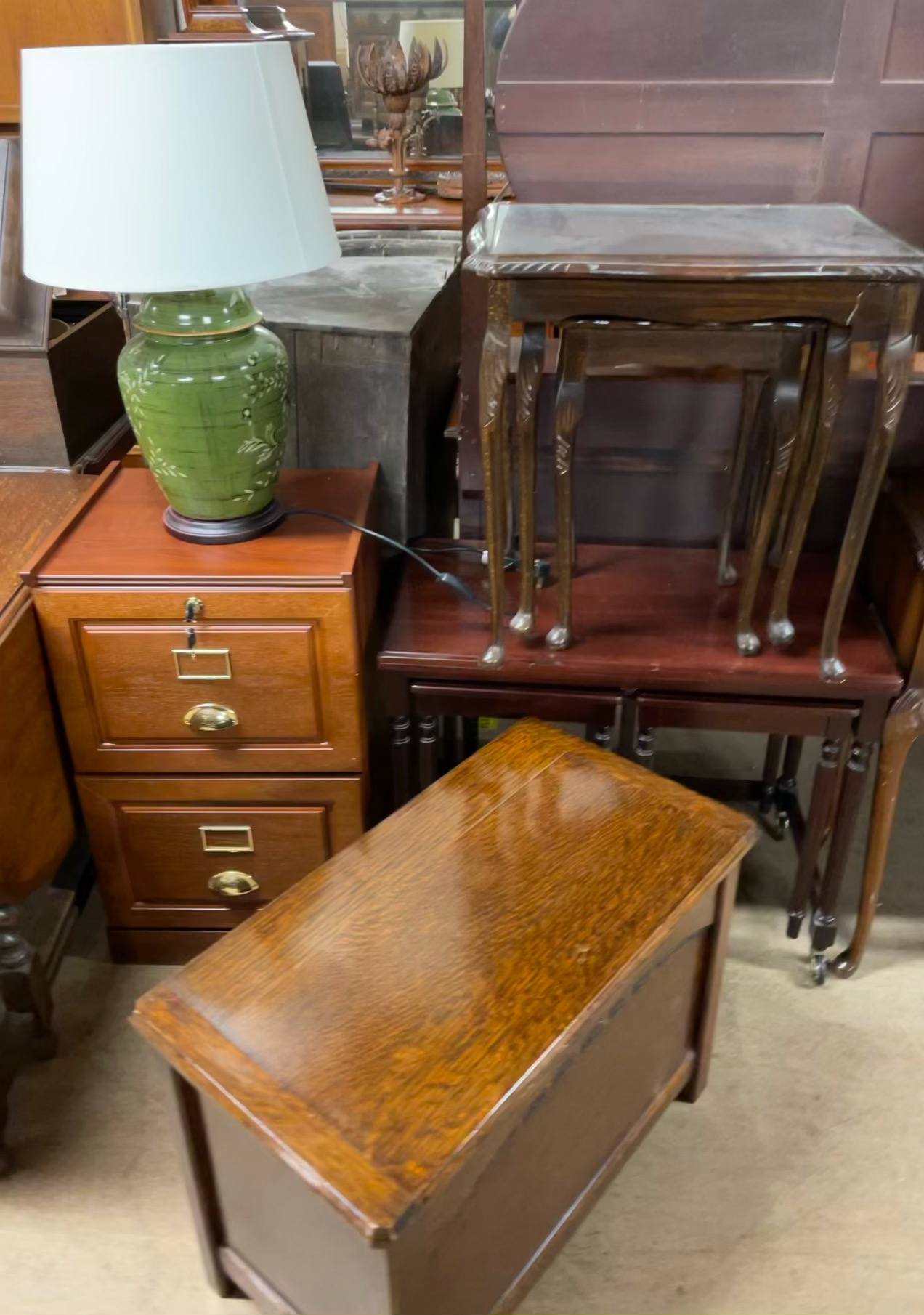 A small oak coffer together with a modern filing cabinet,