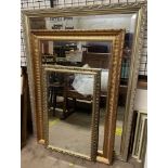 A large rectangular gilt framed wall mirror together with two other wall mirrors