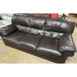 A Three seater brown leather settee