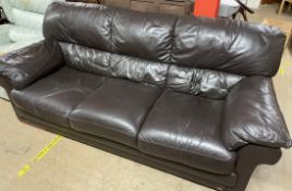 A Three seater brown leather settee