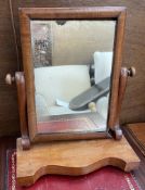 A Victorian mahogany framed toilet mirror with a serpentine base