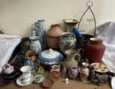 A collection of pottery vases, paperweights,