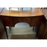 A 19th century mahogany side table with a D shaped top above three drawers on ring turned legs