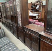 A 20th century oak dining room wall unit, comprising glazed cupboards,