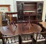 A reproduction mahogany dining suite including an extending dining table,