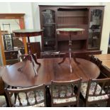 A reproduction mahogany dining suite including an extending dining table,