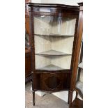 A 20th century mahogany standing corner cupboard,