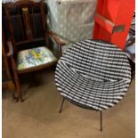 A mid 20th century black and white chair together with an Art Nouveau inspired elbow chair