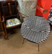 A mid 20th century black and white chair together with an Art Nouveau inspired elbow chair