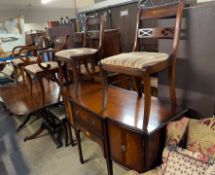 A reproduction Regency style mahogany dining suite comprising a table,