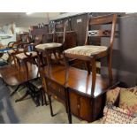 A reproduction Regency style mahogany dining suite comprising a table,