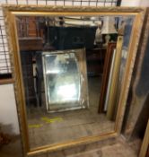 A large gilt framed wall mirror together with three other wall mirrors