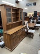 An Ercol dining suite comprising an extending dining table,