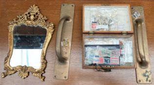 A pair of brass door handles together with a gilt wall mirror and a box containing stamps