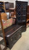 An 18th century oak coffer with a geometric front together with a standing corner cupboard