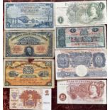 A collection of bank notes including £1 and 10 shilling notes.