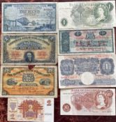 A collection of bank notes including £1 and 10 shilling notes.