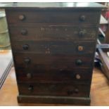 A table top collectors cabinet,