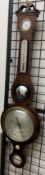 A 19th century mahogany banjo barometer, with a broken swan neck pediment, hydrometer,