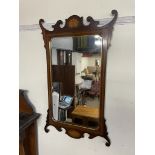 A George III style mahogany wall mirror, the top with a leaf inlaid decoration,