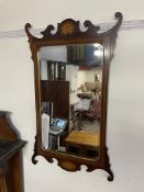 A George III style mahogany wall mirror, the top with a leaf inlaid decoration,