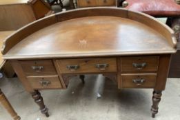 A Victorian mahogany side table of D shape above five drawers on turned legs