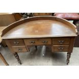 A Victorian mahogany side table of D shape above five drawers on turned legs