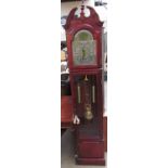 A modern mahogany 31 day longcase clock with a glazed door together with An Australian didgeridoo,