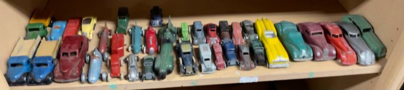 A Tootsie toy model car together with a collection of model cars and trucks