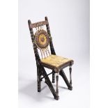 CARLO BUGATTI 1856 - 1940: A CHAIR Ca. 1900 Ebonized walnut, tin inlay, hammered and patinated