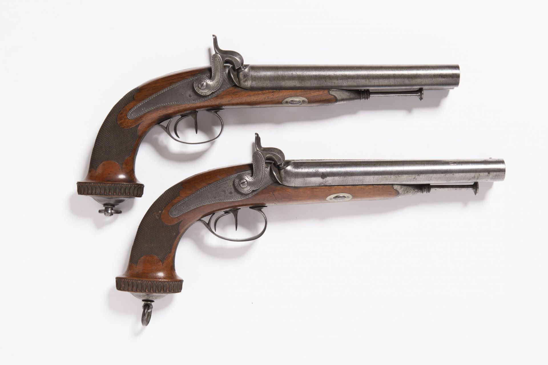 PAIRED TWO SHOT PERCUSSION PISTOLS Around the mid-19th century Central Europe Steel, walnut wood