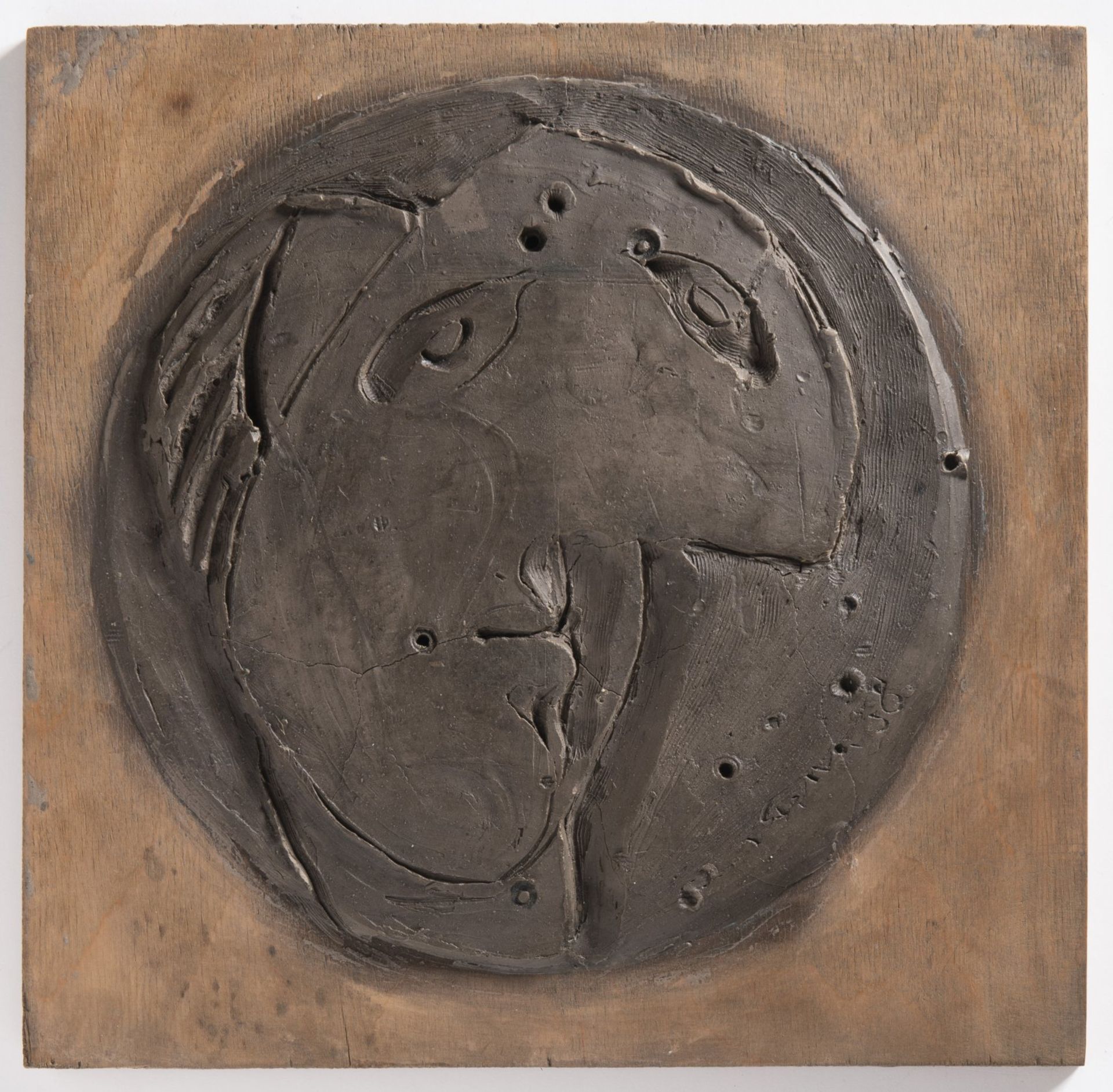 EMIL FILLA 1882 - 1953: A WOMAN 1938 Modelling clay on plywood 25 x 25,5 cm Signed: Lower right "