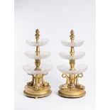 PAIRED EMPIRE ETAGERES Ca. 1800 Central Europe Gilded wood, cut glass 33,5 cm A pair of gilded
