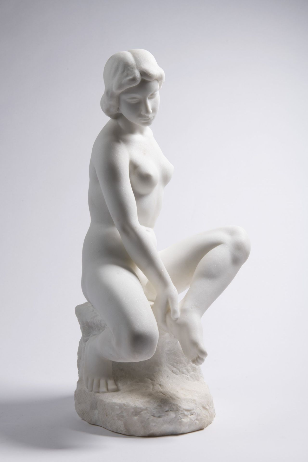 BŘETISLAV BENDA 1897 - 1983: IN A BATH 1937 Carrara marble 51 cm During the bath, the girl expresses
