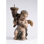 PUTTO - TORCHBEARER 18th century Central Europe Polychrome and gilded wood, metal 38 cm Putto