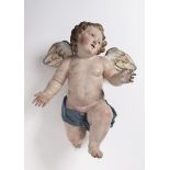 A FLYING PUTTO 18th century Italy Naples Polychrome wood, glass 43 cm Wood carving of a flying putto