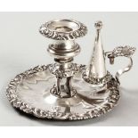 A GEORGE V SILVER CHAMBERSTICK, SHEFFIELD 1920, I.S.T.S., the removable waxpan embossed with flowers