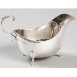 A GEORGE V SILVER SAUCE BOAT, BIRMINGHAM 1913 A & CO. LTD., fold-over rim, plain body with an