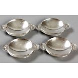 A SET OF FOUR GEORG JENSEN STERLING SILVER MINT DISHES, with fold-over rims, applied shell-form