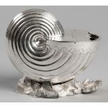 A SILVERPLATE SPOON WARMER, of shell form, standing on a rocky surface base, 14,5cm (height).