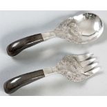 A PAIR OF ARABIC SILVER AND BAKELITE SALAD SERVERS, with pistol grip bakelite handles, the spoon and