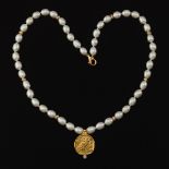 Gold Athena Pendant on Pearl Necklace