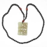 Chinese Black Onyx, Carnelian and Antique Carved Mutton Fat Jade Pendant