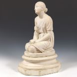 Carved Stone Sculpture of a Kneeling Woman