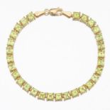 Ladies' Gold and Peridot Tennis Bracelet