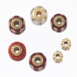 A Group of Gold and Glass Pandora Beads