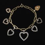 Ladies' Whimsical Two-Tone Gold and Diamond Heart Charm Bracelet