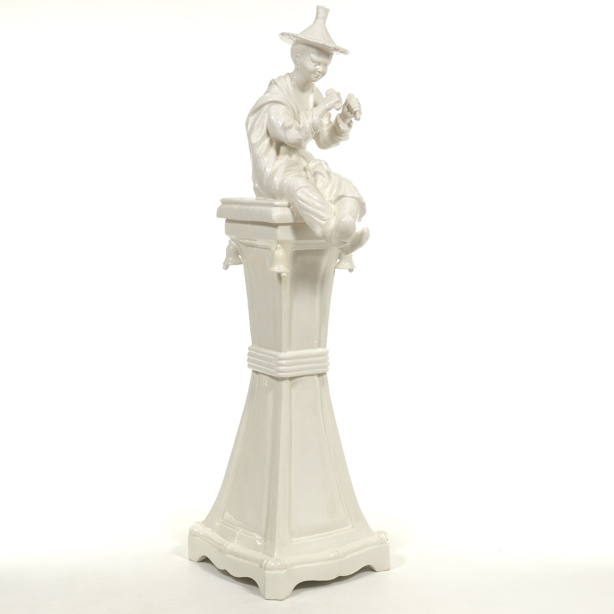 Ceramic Sculpture of a Boy on a Pedestal