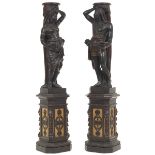 Two Impressive Carved Ebonized and Gilt Wood Blackamoor Nubian Sculptures, on Pedestals, ca. 19th C