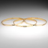 Three Ladies' High Carat Gold Fluted Bangles